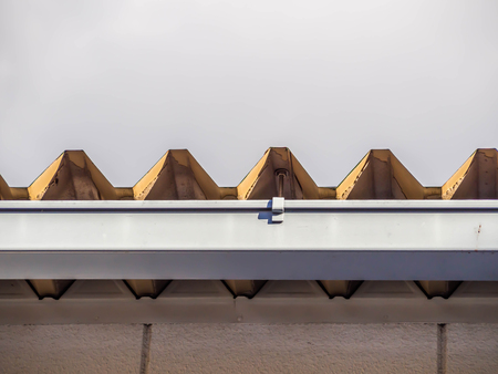 Abstract roof curve and shapes pattern with cloudy sky.の写真素材
