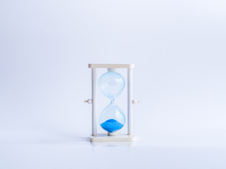 Timeout hourglass and gray background.の写真素材