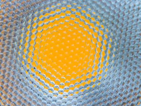 Abstract and closeup of white circle shape pattern on yellow background.の写真素材