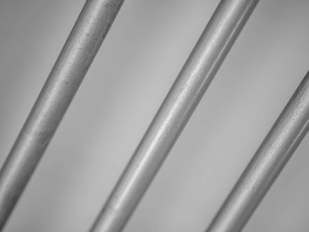Abstract black and white tone of diagonal stripes pattern of metal.
