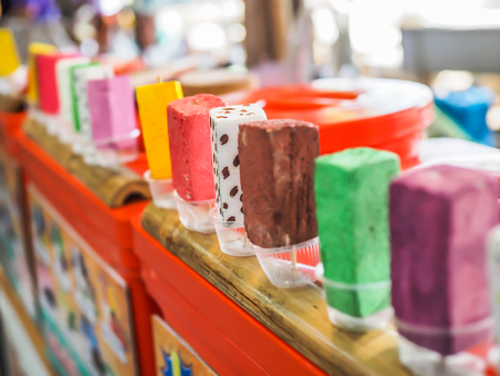 Closeup of Thai dessert, multicolored and colorful row of Asian ice cream bar at street food local market.の写真素材