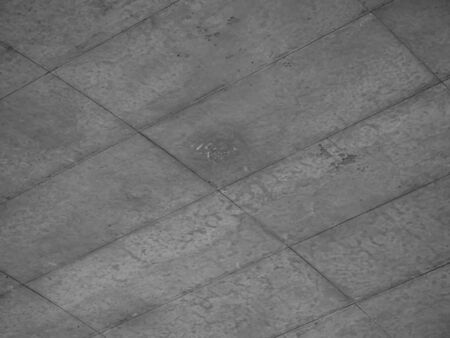 Abstract black and white tone of grids or tiles pattern of cement or concrete texture for floor or wall background.の写真素材