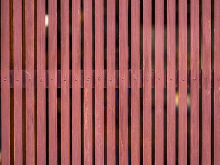 Abstract brown vertical striped pattern of wooden wall background.の写真素材