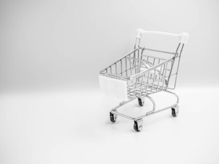 Black and white tone of Closeup trolley or shopping or supermarket cart toy on gray background.の写真素材