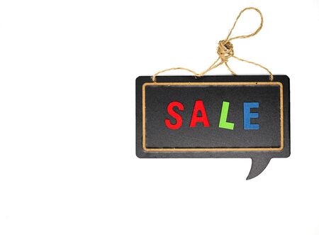 Top view or directly above of sale campaign. Multicolored wooden letters of sale word on blackboard...