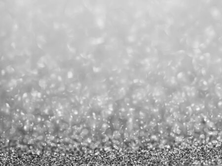 Abstract black and white tone of blurry bokeh glitter shiny texture and background.の写真素材