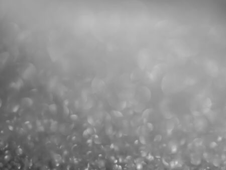 Abstract black and white tone of blurry bokeh glitter shiny texture and background.の写真素材