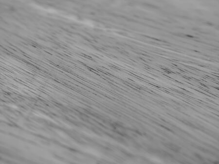 Abstract black and white tone of wooden texture, diagonal striped pattern and gradient background.の写真素材