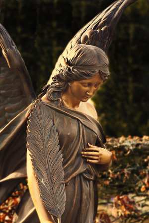 angel statue on Melaten graveyard in germanyの写真素材