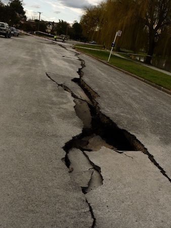 Christchurch, New Zealand, September 4 2010: Crack through road from Earthquake by Avon Riverのeditorial素材