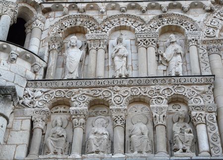 Carved statues on the exterior of Notre Dame Cathedral in Poitiers, Franceの写真素材