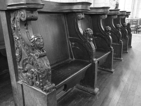 Black and white image of medieval wooden choir stalls in the Cathedrale Saint Pierre in Poitiers, Franceのeditorial素材