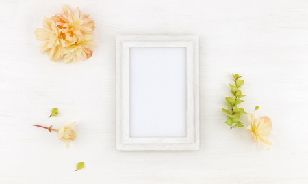 Flatlay wooden frame mockup with flowers, on white background