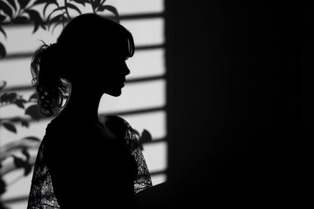 Silhouette of a beautiful young woman. Stylish glamour close-up black and white photography. AI generativeの素材