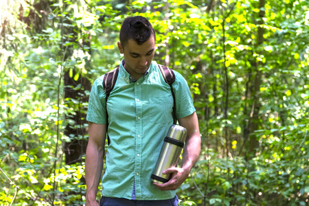 A man walks in the woods. A traveler, a tourist. Summer. Autumn.の写真素材
