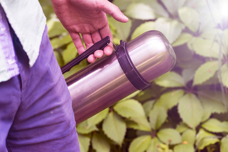 The man with the thermos. Picnic, Hiking, summer, autumn.の写真素材