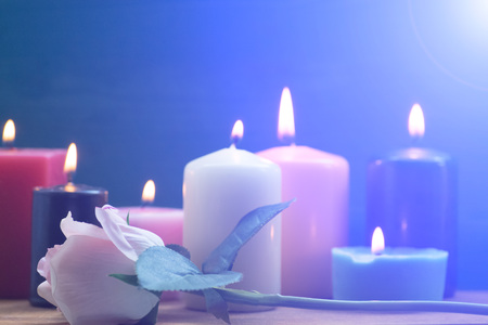 Rose and candle on the tableの写真素材