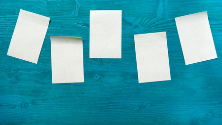 Stickers on colored wood background.の写真素材