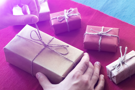 The man wraps gifts