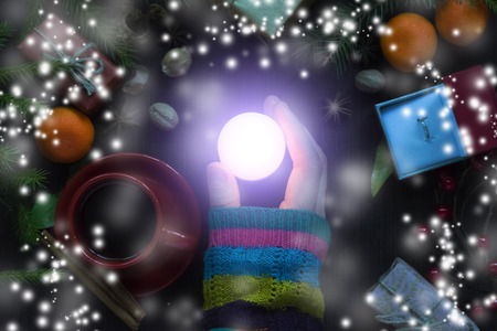 A man holds a candle in his hand. Christmas, new year.の写真素材