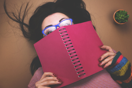 The girl reads book, diary.