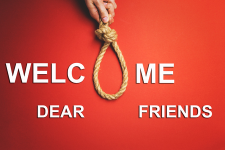 A man pulls a noose. The concept of the real relationship between people.の写真素材