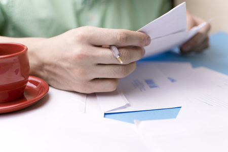 A man signs the papers. Mail.の写真素材