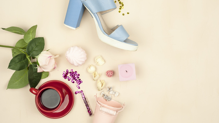 Flowers, marshmallows, cream color, rose, shoe on pastel background. Still life.の写真素材