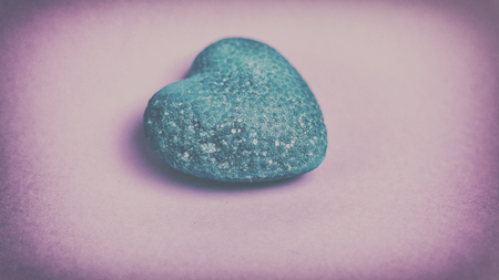Blue heart on a pink background. Vintage.の写真素材