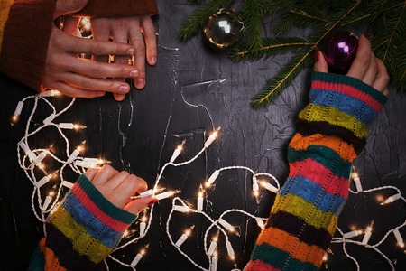 A man and a woman decorate the Christmas tree together. The view from the top.の写真素材