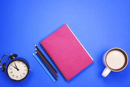 Different office supplies and other tools on a colored background. The concept of the workplace.の写真素材