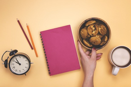 Different office supplies and other tools on a colored background. The concept of the workplace.の写真素材