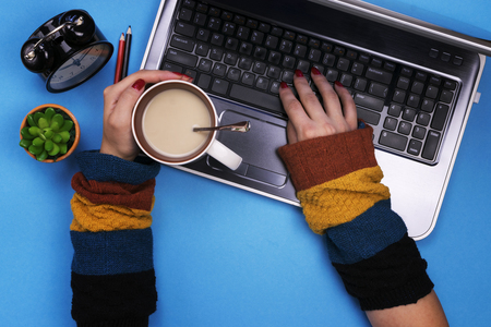 The girl works at the computer. Freelance, home job.の写真素材