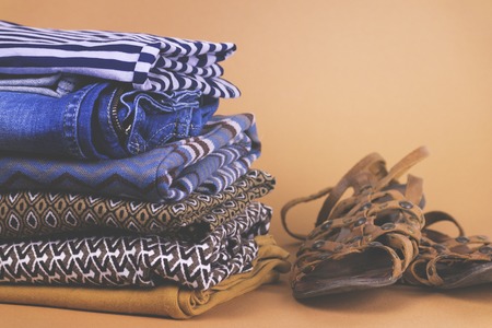 Women's shoes, clothing and accessories on a colored backgroundの写真素材