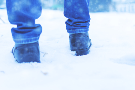 A man walks in the snow. Mens shoes. Close upの写真素材
