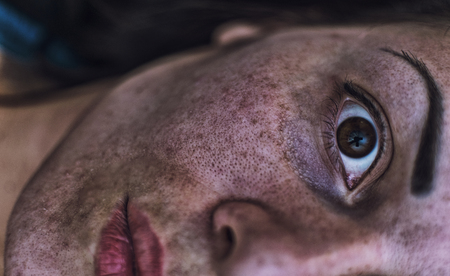 The girl in the mud. Close up. The concept of battle, struggle.の写真素材