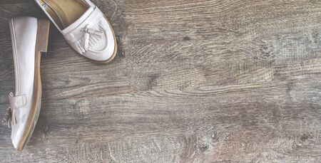 Loafers shoes retro style stand on the wooden floorの写真素材