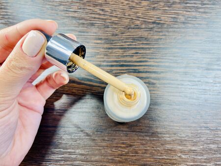 The girl chooses cosmetics. Mobile photo. A close-upの写真素材