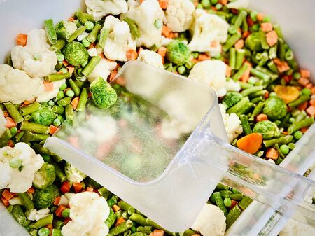 Different vegetable mixtures in the container. Mobile photo. A close-up. Supermarket