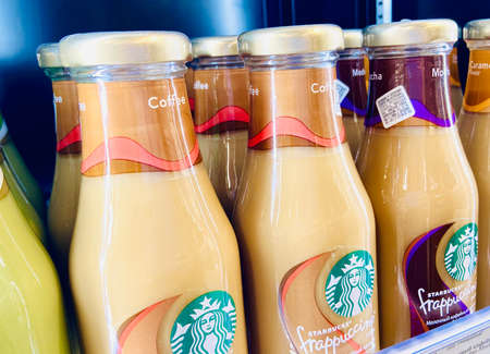 Starbucks cocktails in a glass bottle. Photo on mobile in a supermarket Belarusのeditorial素材
