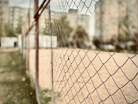 A metal mesh around the children's yard. Photo on mobile in the Republic of Belarusの写真素材