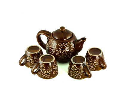 coffee and teapot cups in traditional setting.のeditorial素材