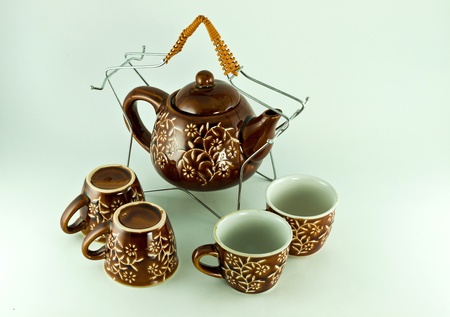 coffee and teapot cups in traditional setting.のeditorial素材