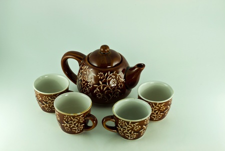 coffee and teapot cups in traditional setting.のeditorial素材