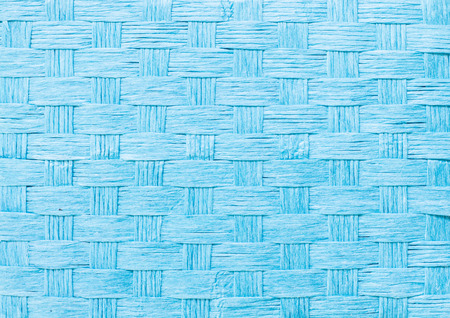 Aquamarine straw wicker basket close-up texture background