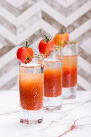 Bloody mary shots garnish with half a tomatoの写真素材