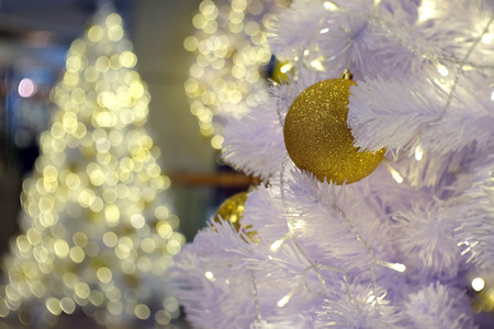 Christmas gold ball with white tree on bokeh shinny christmas Tree background.の写真素材