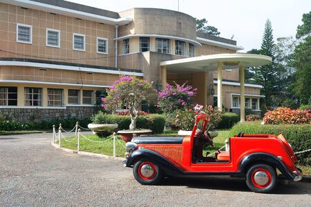 DA LAT CITY, VIETNAM-January 12: The Third Mansion of the Vietnamese last emperor with Red Vintage Car in Da lat City, Vietnam on Jan 12, 2018 at South Vietnamのeditorial素材