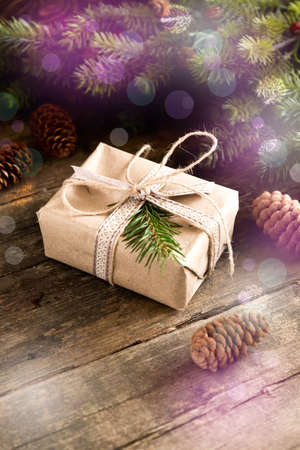 Gift cones and fir branches on wooden background Filterの写真素材