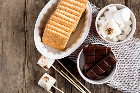 Ingredients for smores Above wooden backgroundの写真素材